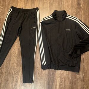 Adidas original track suit. Top and bottom but can be purchased separately.